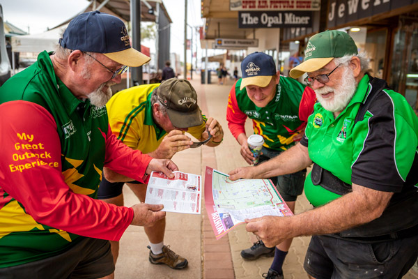 volunteers looking at site map for outback festival
